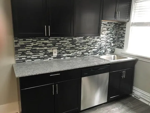 a kitchen with a sink and a cabinets