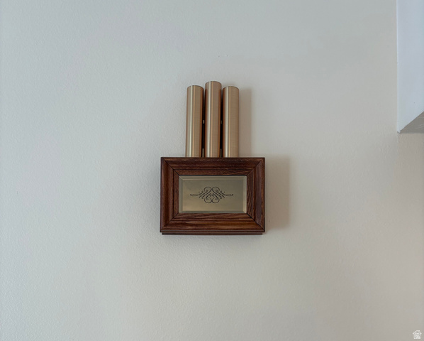 595 Meadowlark Road Orem, UT 84097 - Photo 47 of 87 Decorative chime unit with a wood-finish frame and three vertical brass-tone tubes