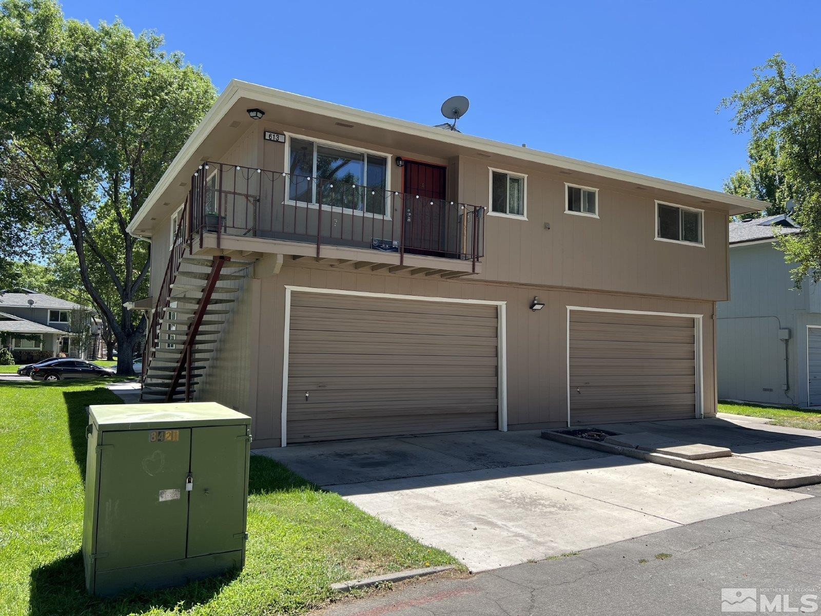 a front view of a house with a garage