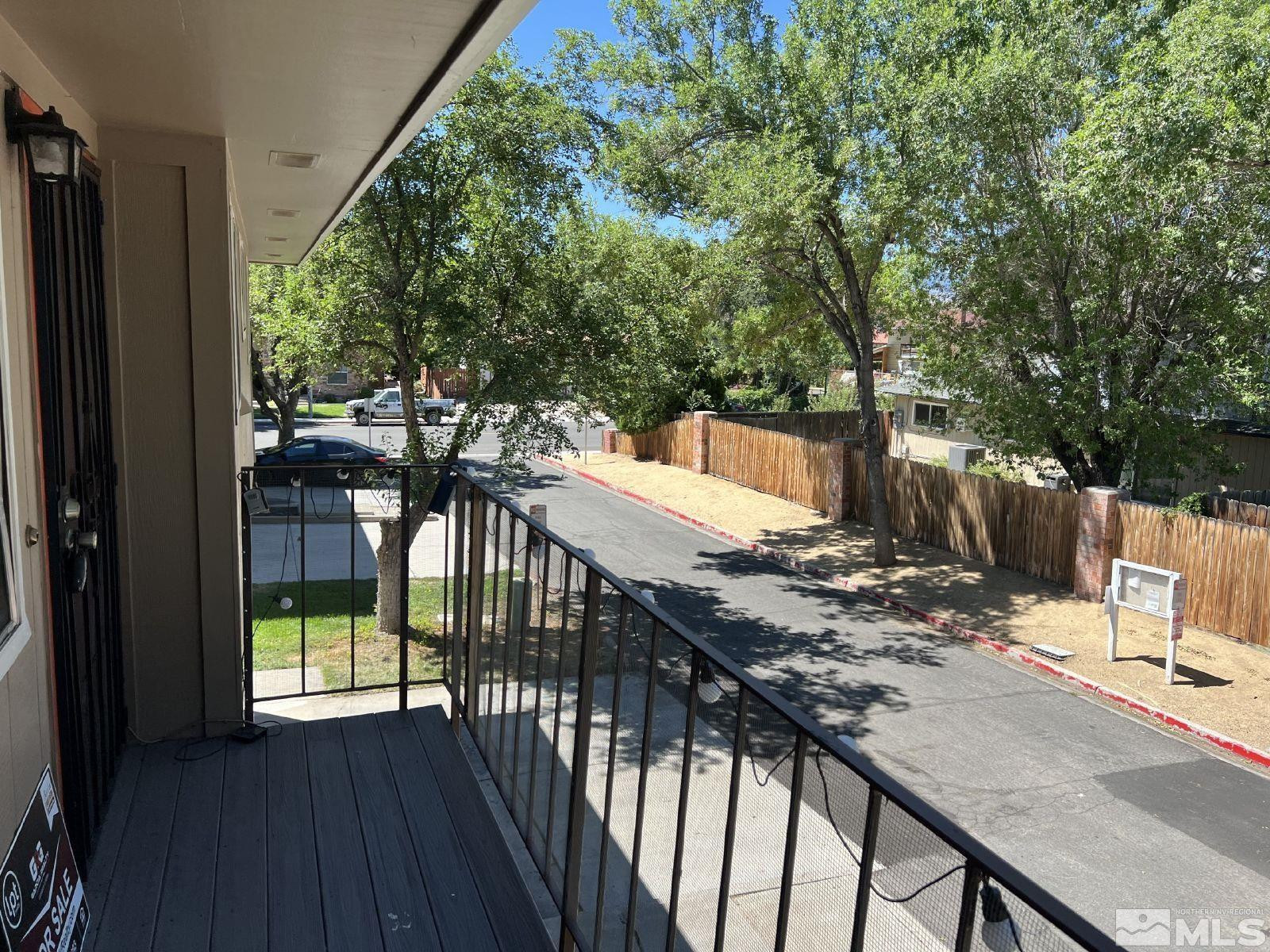 613 Pine Meadows Drive, Unit 4 Sparks, NV 89431 - Photo 11 of 14 a view of balcony with wooden floor and fence