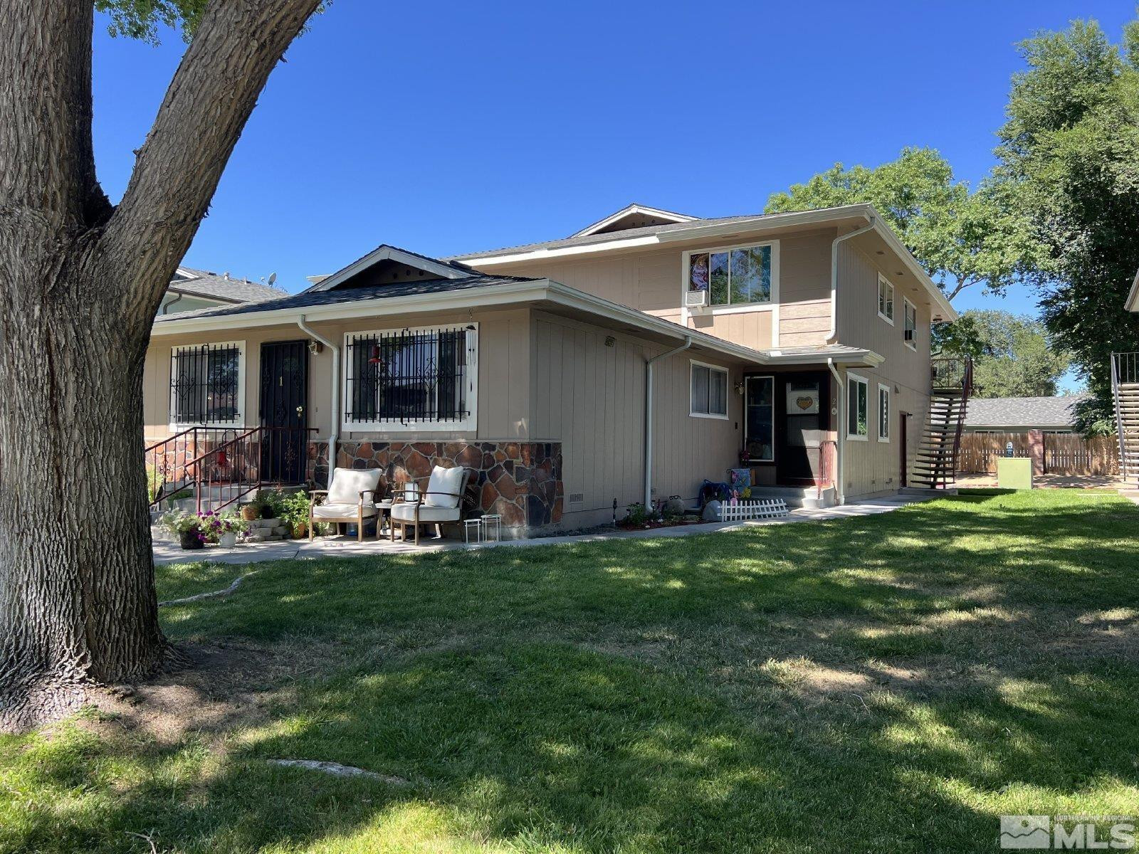 613 Pine Meadows Drive, Unit 4 Sparks, NV 89431 - Photo 14 of 14 a front view of a house with a garden