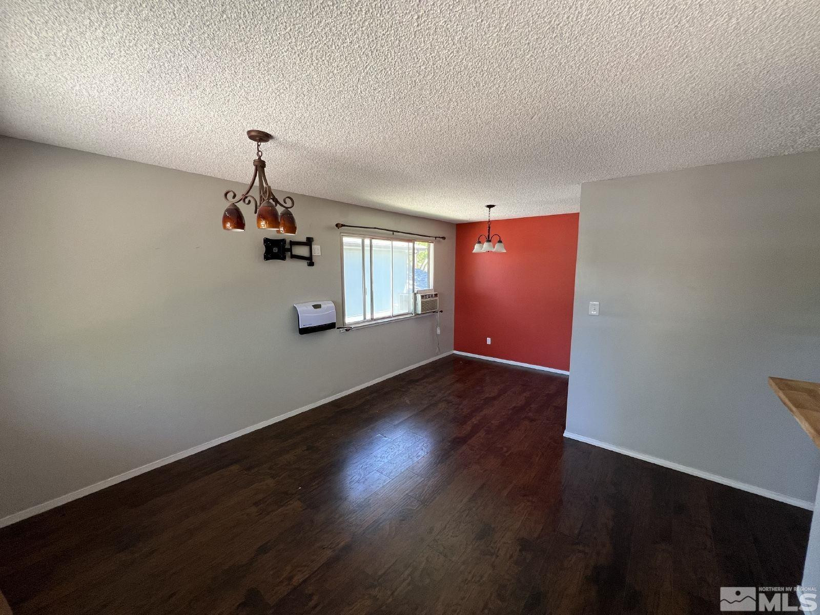 613 Pine Meadows Drive, Unit 4 Sparks, NV 89431 - Photo 4 of 14 a view of a livingroom with wooden floor and a window