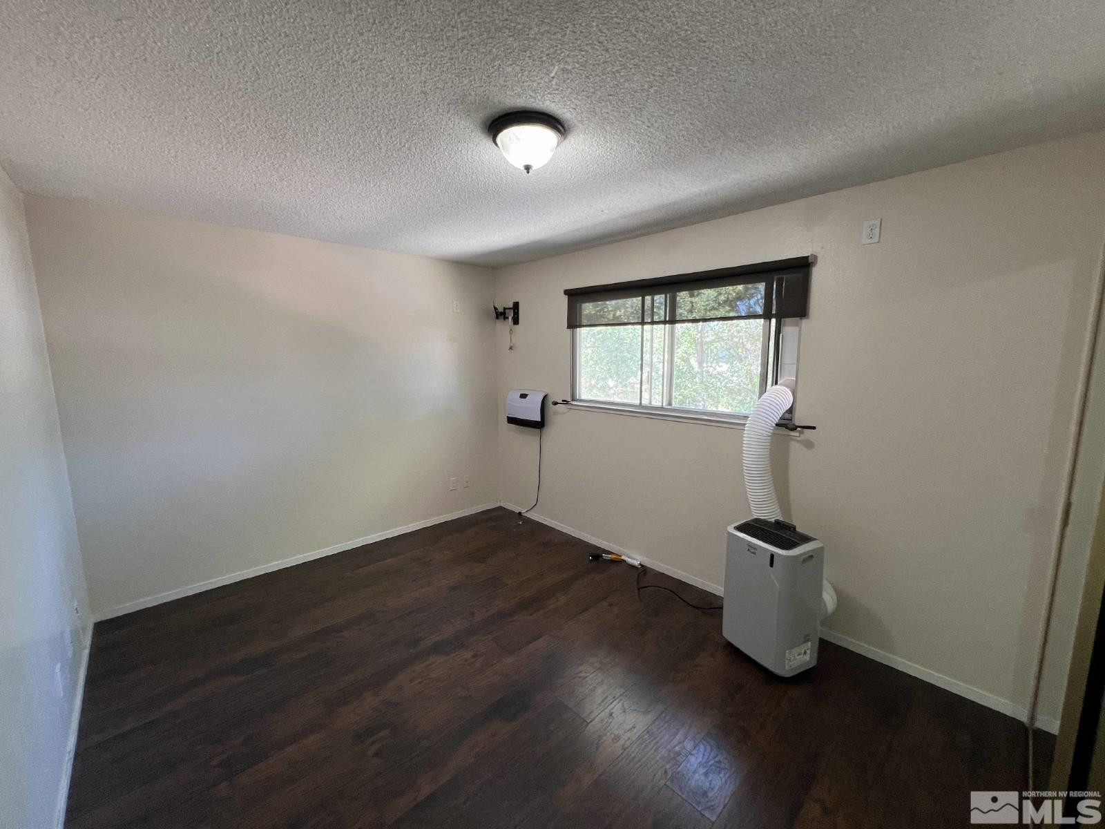 613 Pine Meadows Drive, Unit 4 Sparks, NV 89431 - Photo 9 of 14 an empty room with windows