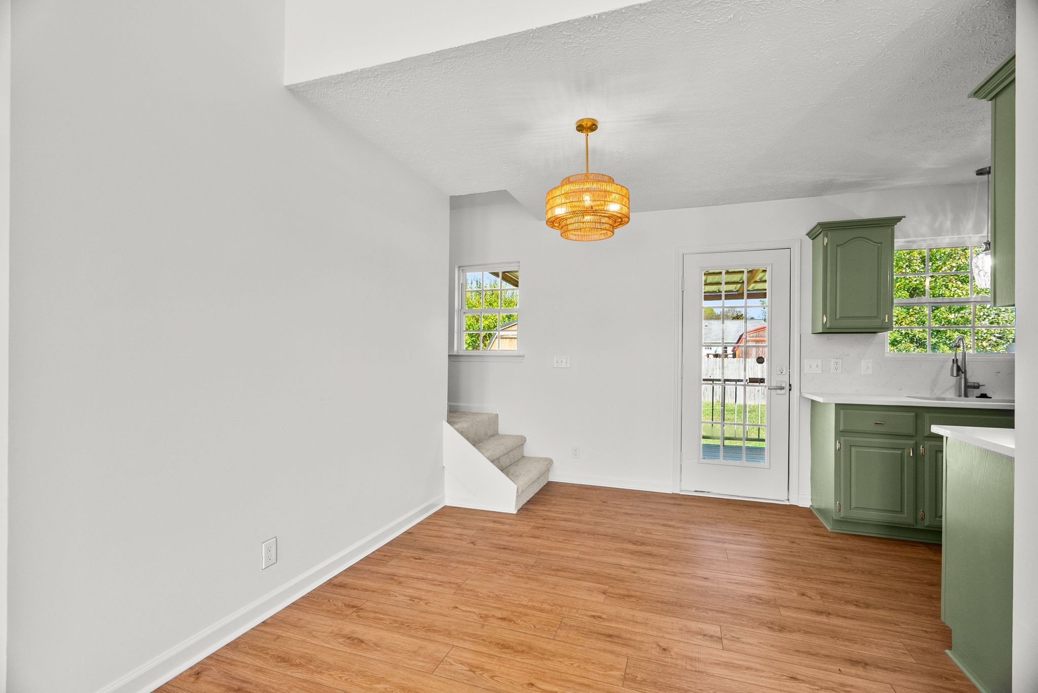 116 Chad Street East Portland, TN 37148 - Photo 12 of 34 a view of an empty room and window and wooden floor