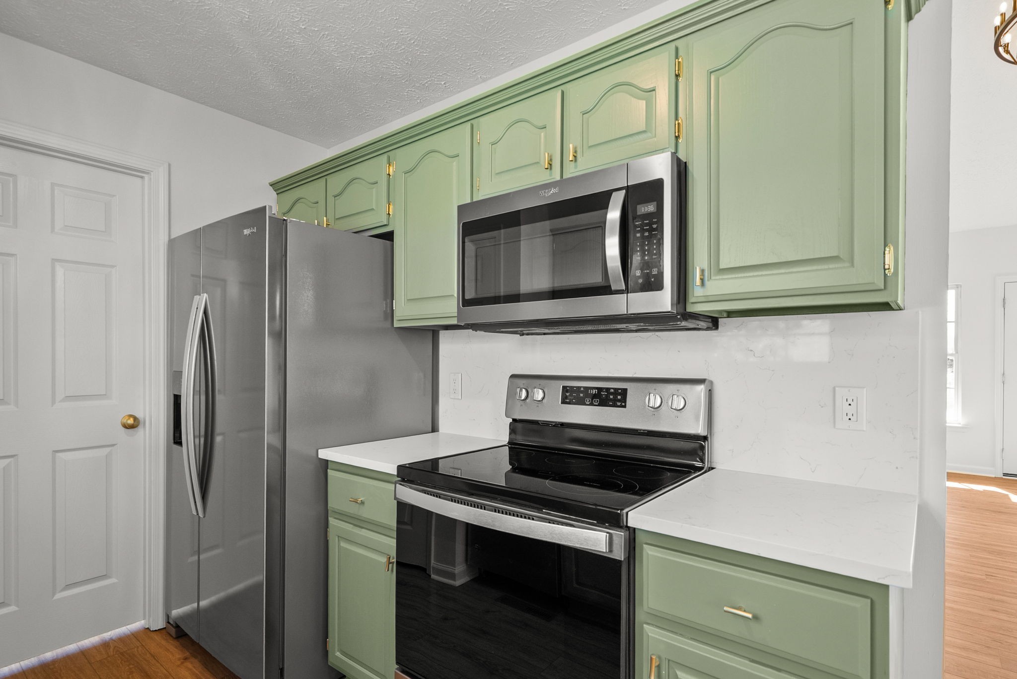116 Chad Street East Portland, TN 37148 - Photo 14 of 34 a kitchen with stainless steel appliances a stove microwave and refrigerator