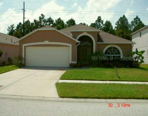 8636 Manassas Road Tampa, FL 33635 - Photo 1 of 1 a front view of a house with a garden