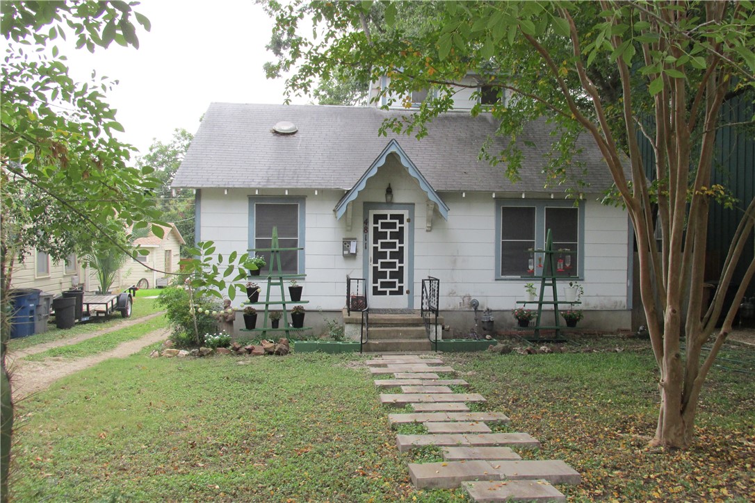 4811 Red River Street Austin, TX 78751 - Photo 1 of 1 a front view of a house with garden