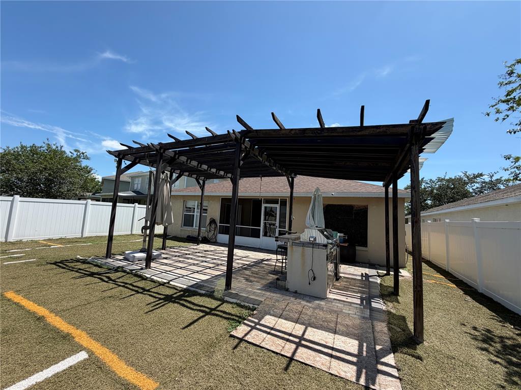 945 Tramells Trail Kissimmee, FL 34744 - Photo 34 of 36 a view of a chairs and table in the patio