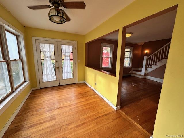 55 Woodhull Landing Road Sound Beach, NY 11789 - Photo 19 of 38 a view of a hallway with wooden floor and windows