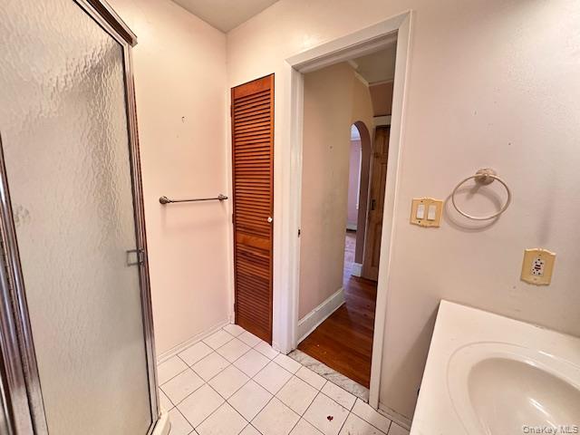 55 Woodhull Landing Road Sound Beach, NY 11789 - Photo 20 of 38 a view of bathroom with a sink and mirror
