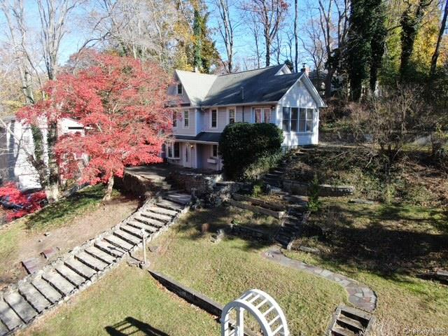 55 Woodhull Landing Road Sound Beach, NY 11789 - Photo 6 of 38 a view of a house with backyard and sitting area