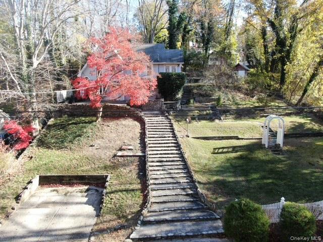 55 Woodhull Landing Road Sound Beach, NY 11789 - Photo 7 of 38 a backyard of a house with lots of green space
