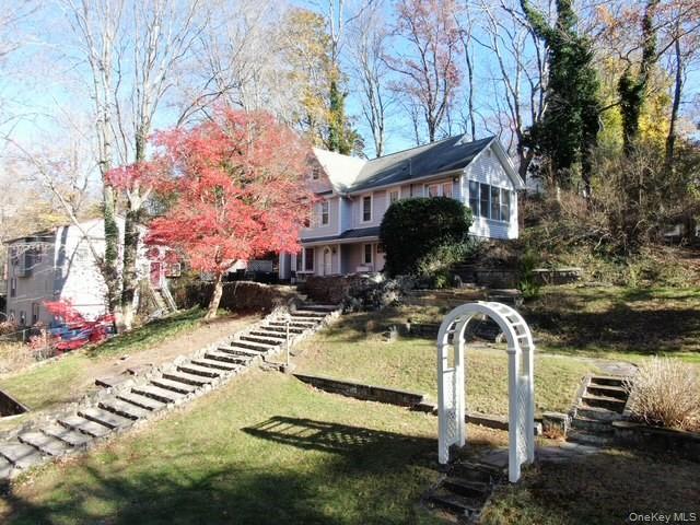 55 Woodhull Landing Road Sound Beach, NY 11789 - Photo 8 of 38 a front view of a house with a yard