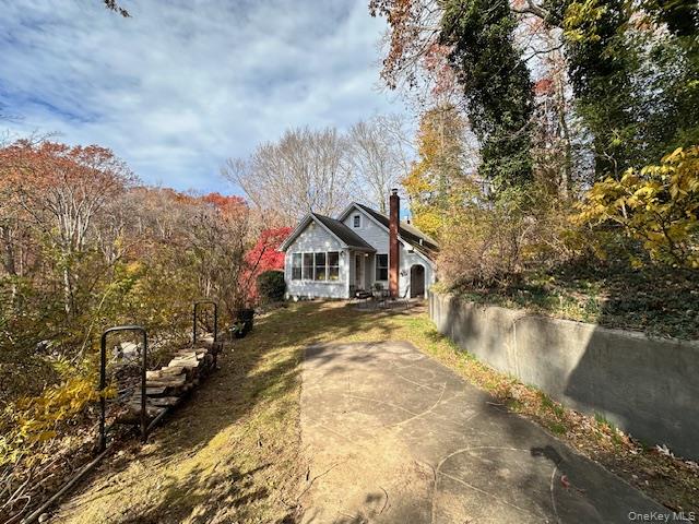 55 Woodhull Landing Road Sound Beach, NY 11789 - Photo 9 of 38 a view of a house with a yard