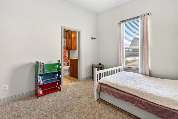 a bedroom with a bed and a cabinets
