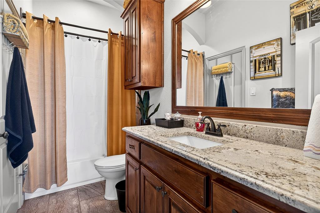 12099 Briargrove Lane Forney, TX 75126 - Photo 21 of 38 Full bathroom featuring vanity and shower / tub combo with curtain