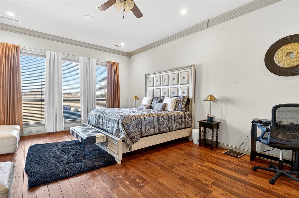 12099 Briargrove Lane Forney, TX 75126 - Photo 22 of 38 Bedroom with ornamental molding, hardwood / wood-style flooring, and a ceiling fan
