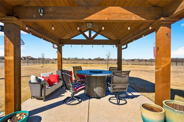 a view of a house with swimming pool and sitting area