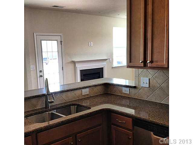 78075 Rillstone Drive Lancaster, SC 29720 - Photo 3 of 5 a kitchen with a sink and a microwave