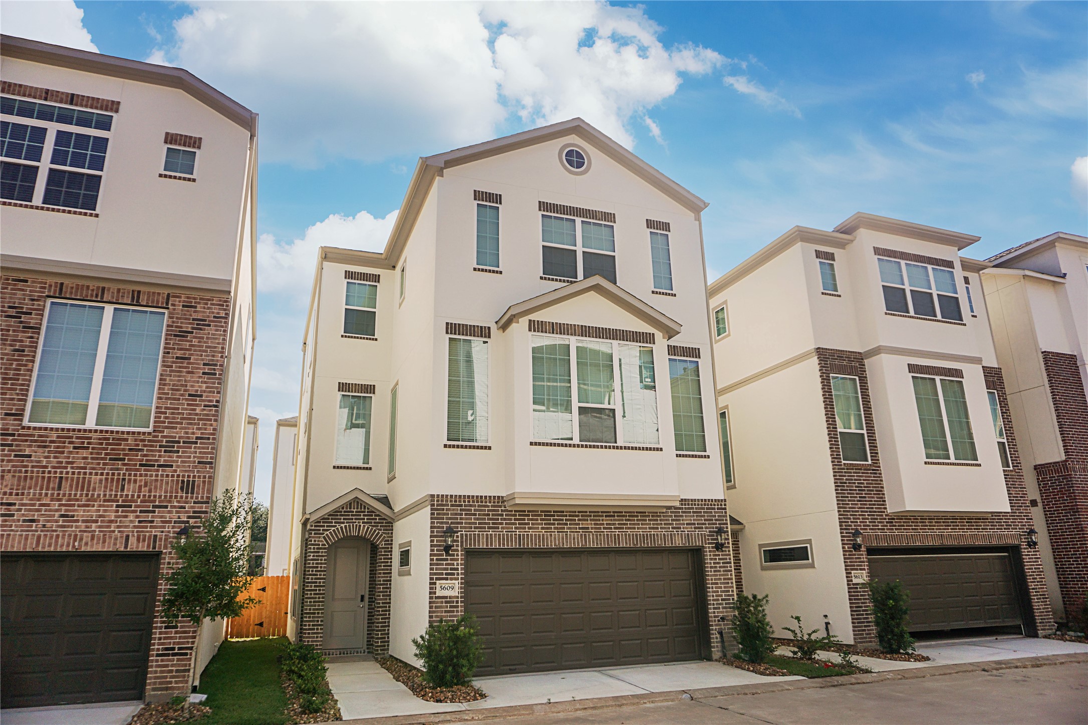 a front view of a house with a garage