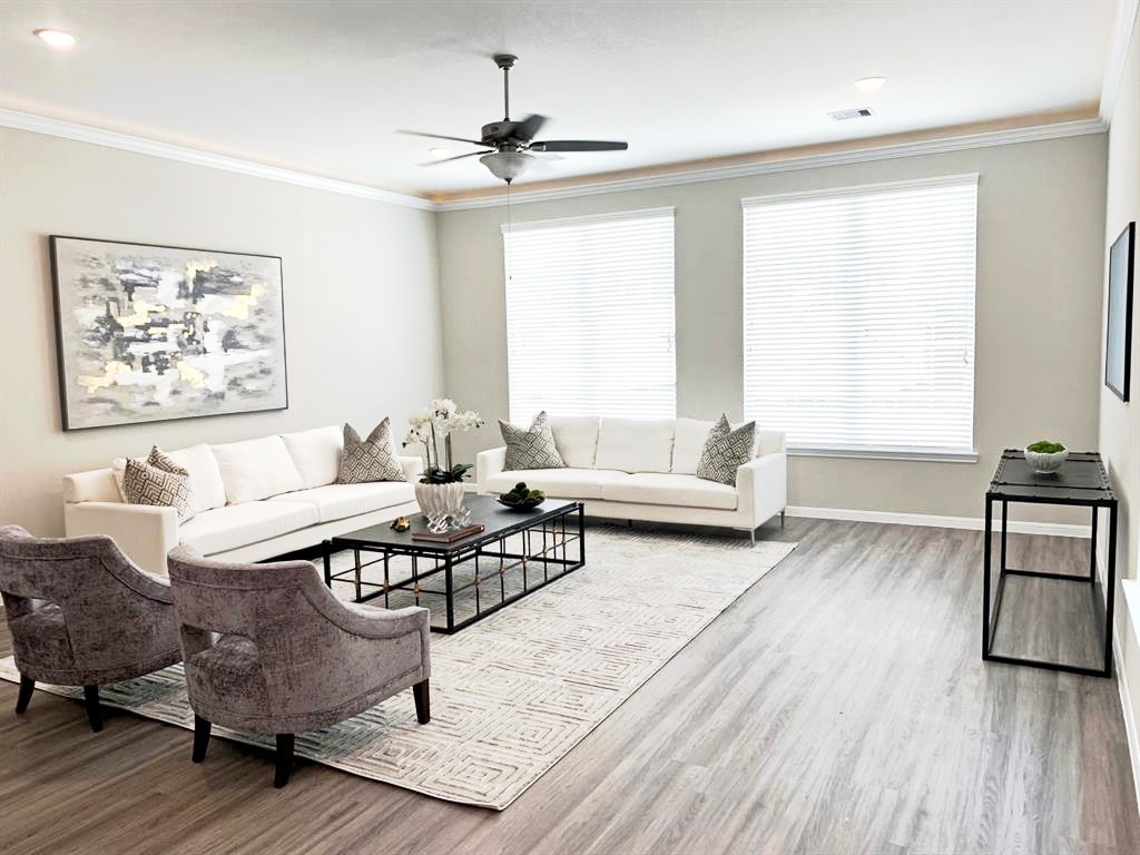 5609 Mina Way Houston, TX 77081 - Photo 2 of 12 a living room with furniture and a large window