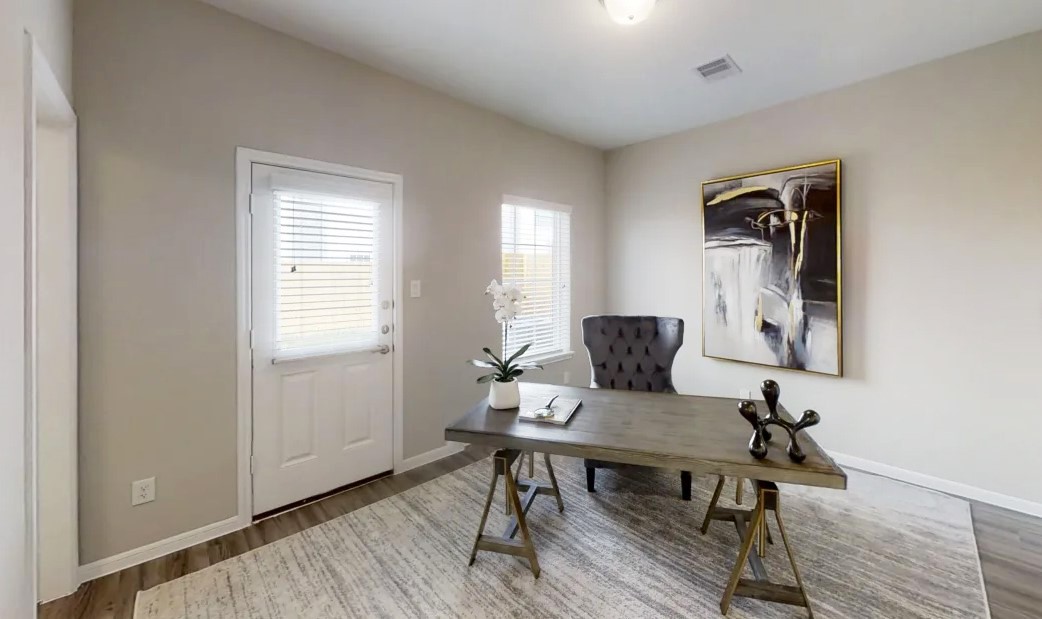 5609 Mina Way Houston, TX 77081 - Photo 5 of 12 a workspace with furniture and wooden floor