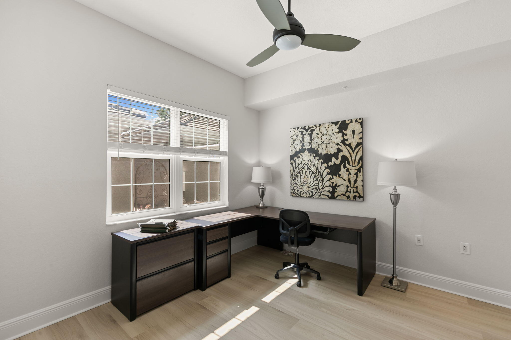 9213 Museo Circle, Unit 103 Naples, FL 34114 - Photo 19 of 47 a view of a workspace with furniture and a window
