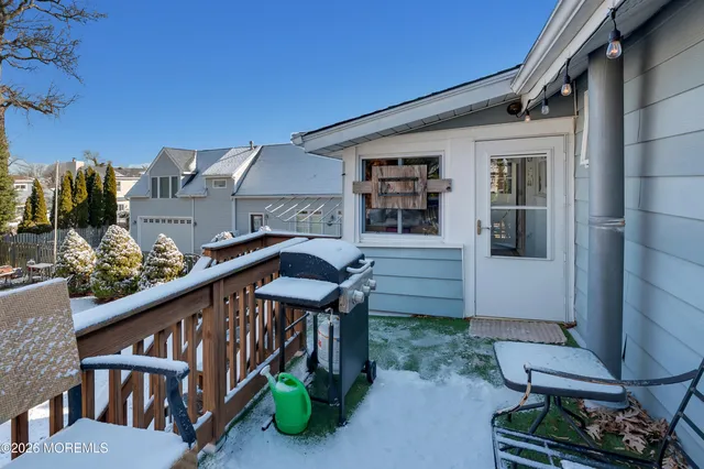 a balcony view with couple of chairs