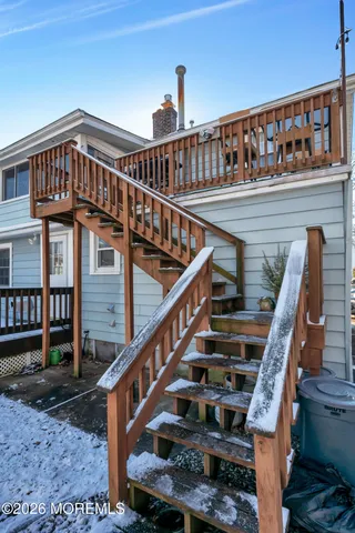 a view of entryway with wooden stairs