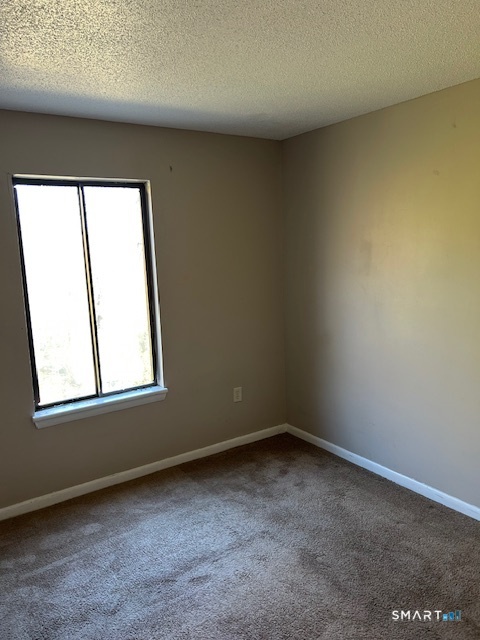 175 Mill Pond Road, Unit 214 Hamden, CT 06514 - Photo 11 of 22 an empty room with a window