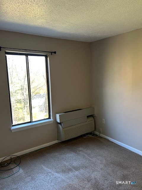 175 Mill Pond Road, Unit 214 Hamden, CT 06514 - Photo 14 of 22 an empty room with a window