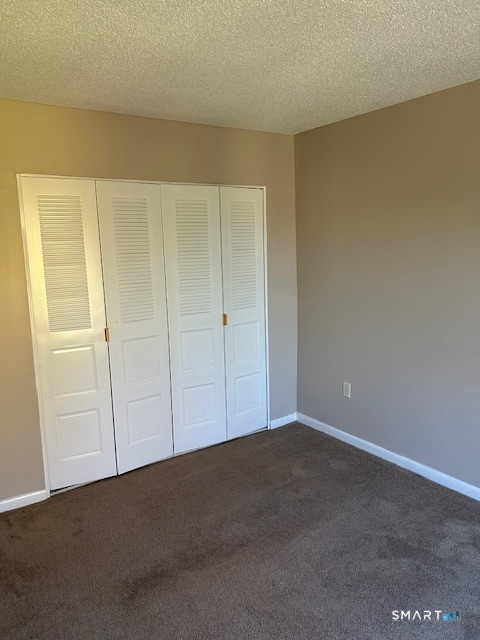 175 Mill Pond Road, Unit 214 Hamden, CT 06514 - Photo 15 of 22 a view of an empty room