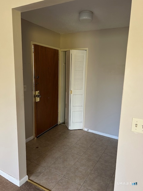 175 Mill Pond Road, Unit 214 Hamden, CT 06514 - Photo 19 of 22 an empty room with closet