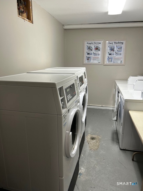 175 Mill Pond Road, Unit 214 Hamden, CT 06514 - Photo 20 of 22 a utility room with dryer and washer