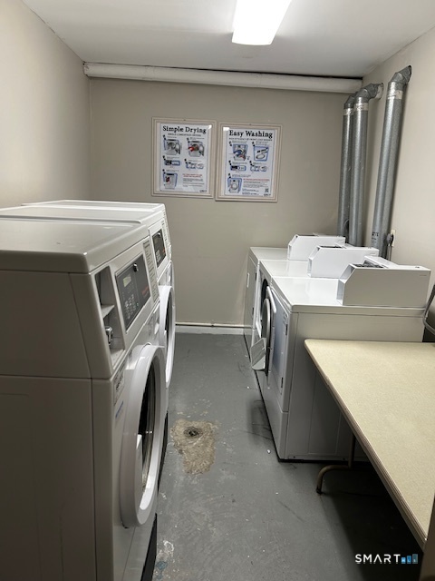 175 Mill Pond Road, Unit 214 Hamden, CT 06514 - Photo 22 of 22 a utility room with dryer and washer