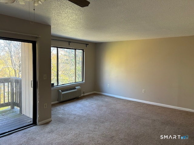 175 Mill Pond Road, Unit 214 Hamden, CT 06514 - Photo 4 of 22 an empty room with windows
