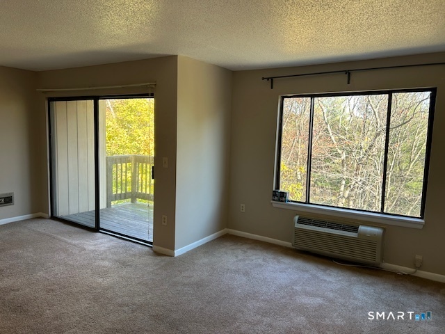 175 Mill Pond Road, Unit 214 Hamden, CT 06514 - Photo 7 of 22 an empty room with windows