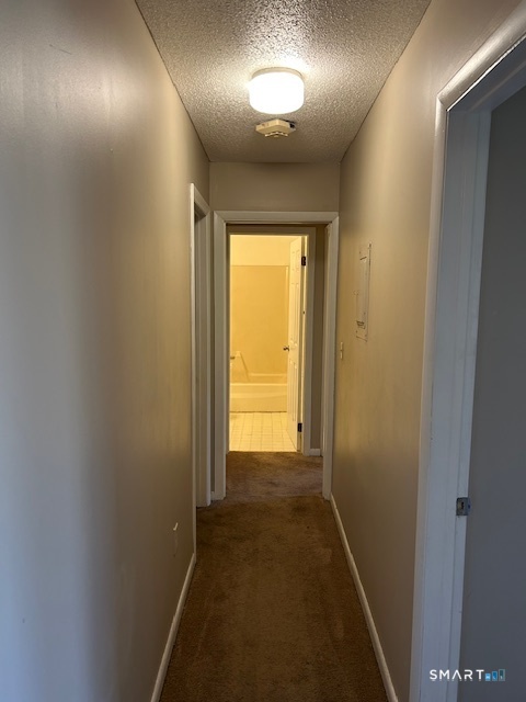 175 Mill Pond Road, Unit 214 Hamden, CT 06514 - Photo 9 of 22 a view of hallway with an entryway