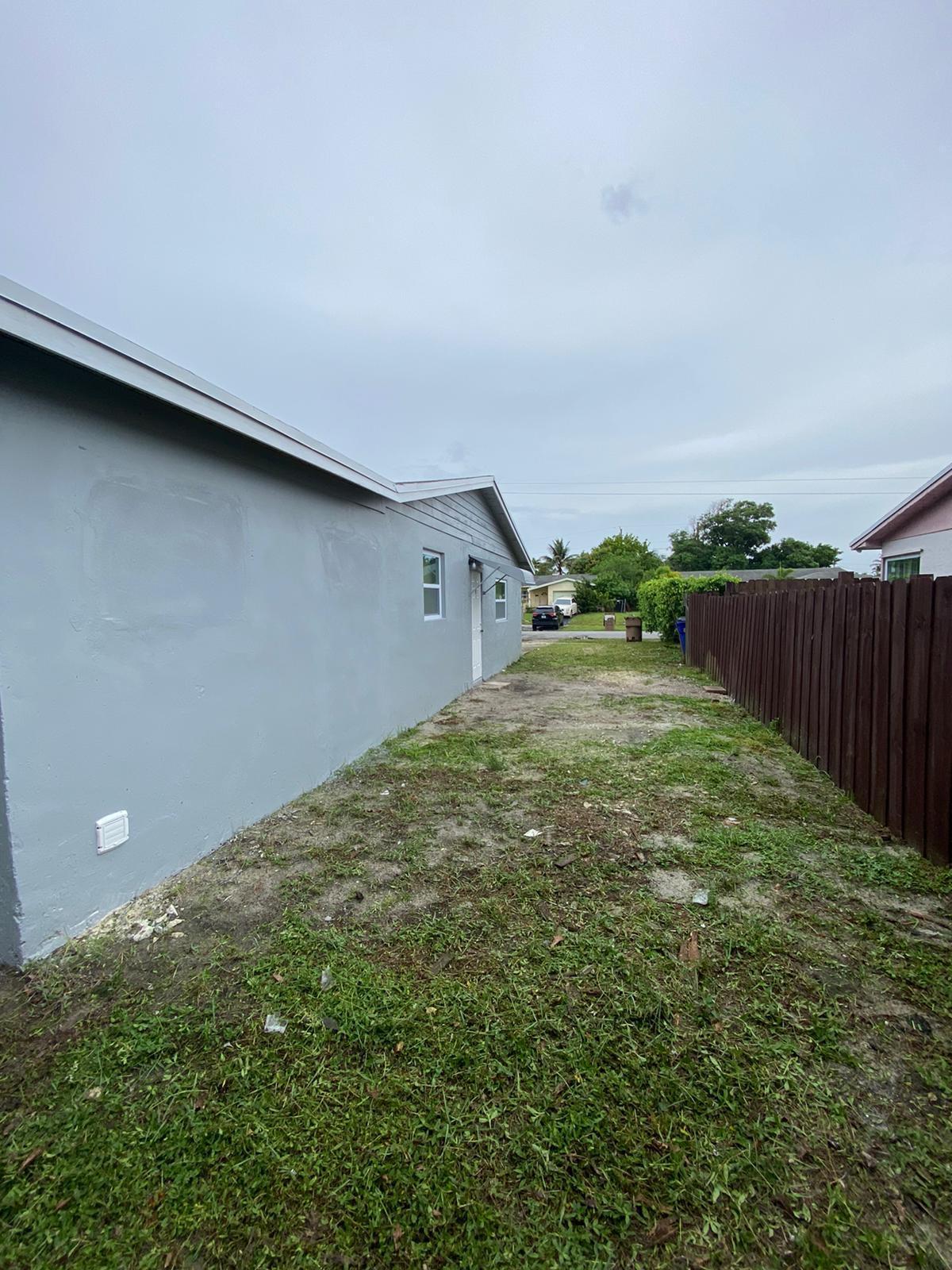 811 Southwest 12th Court Deerfield Beach, FL 33441 - Photo 14 of 16 a backyard of a house