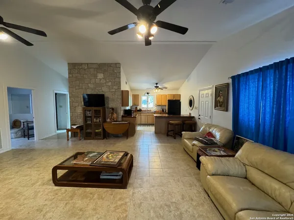 a living room with furniture gym equipment and a fireplace