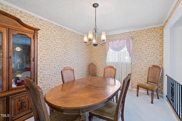a dining room with furniture and window
