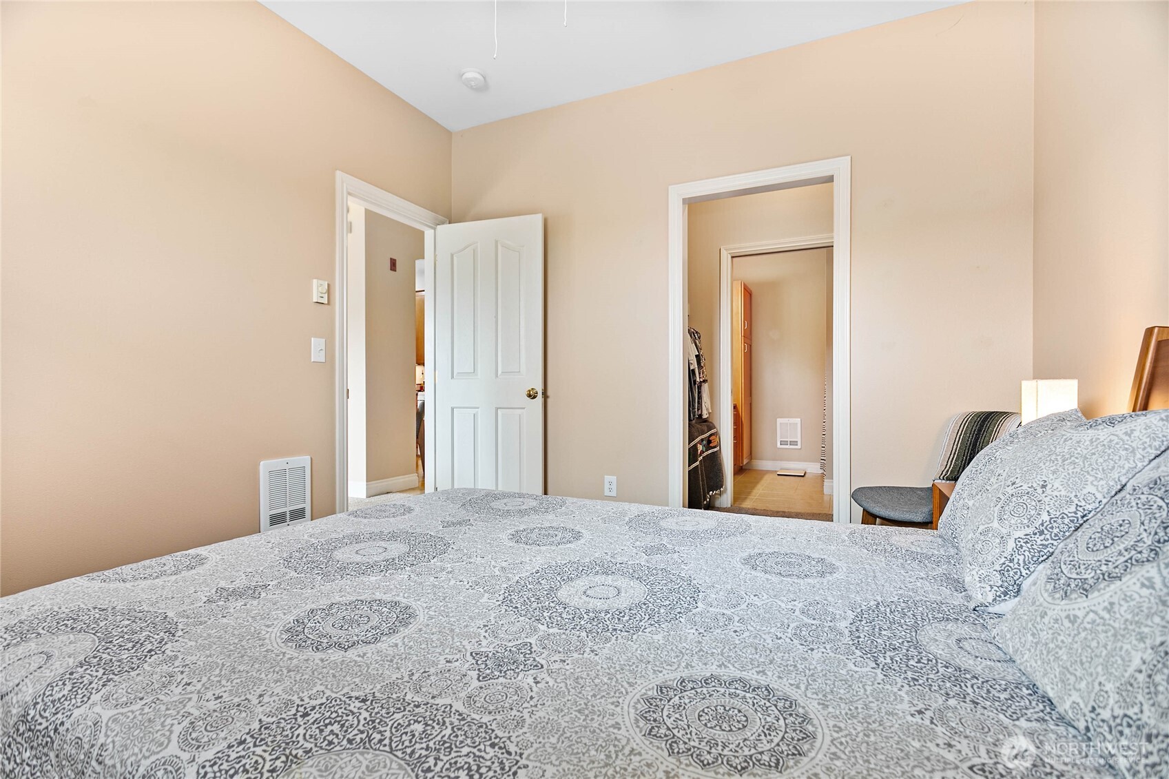 1991 Alder Street, Unit 204 Ferndale, WA 98248 - Photo 13 of 27 a bedroom with a bed and a mirror