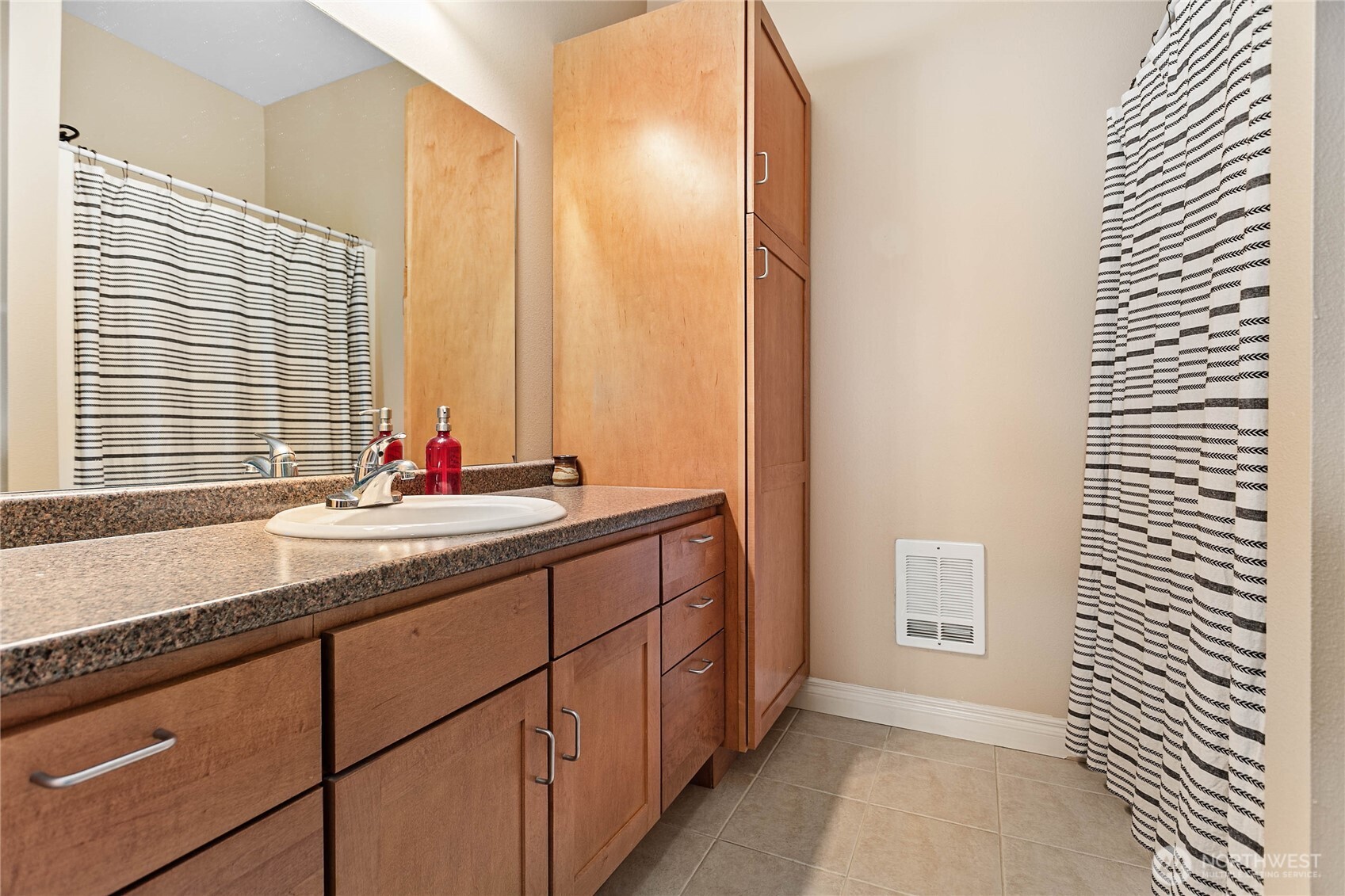 1991 Alder Street, Unit 204 Ferndale, WA 98248 - Photo 15 of 27 a bathroom with a granite countertop sink and a large mirror next to a window