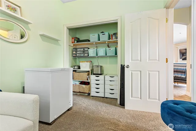 a view of a livingroom with furniture and staircase
