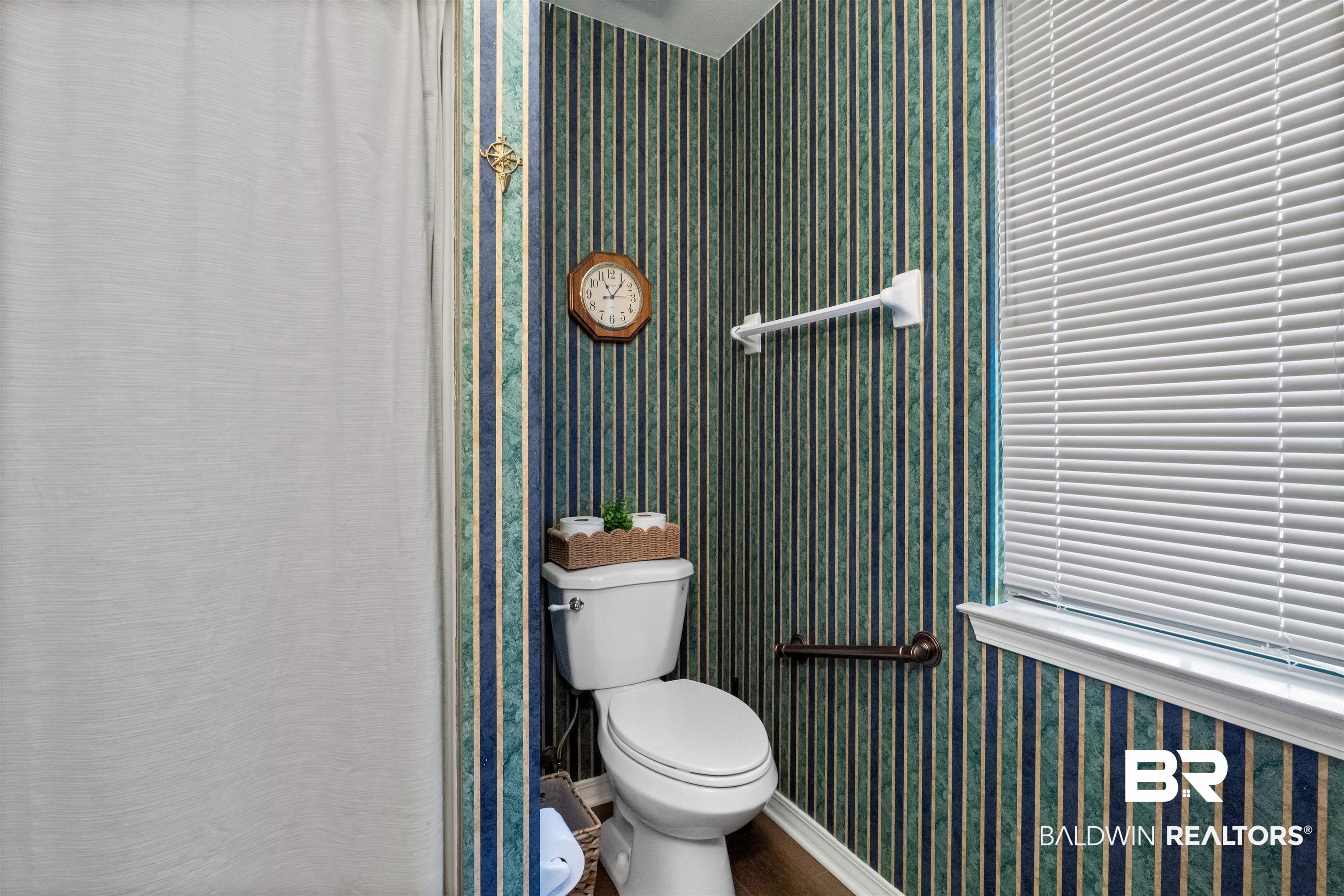 153 Lakeview Loop Daphne, AL 36526 - Photo 42 of 56 Easily accessible from the secondary bedrooms, this full bath comfortably serves both family members and overnight guests.