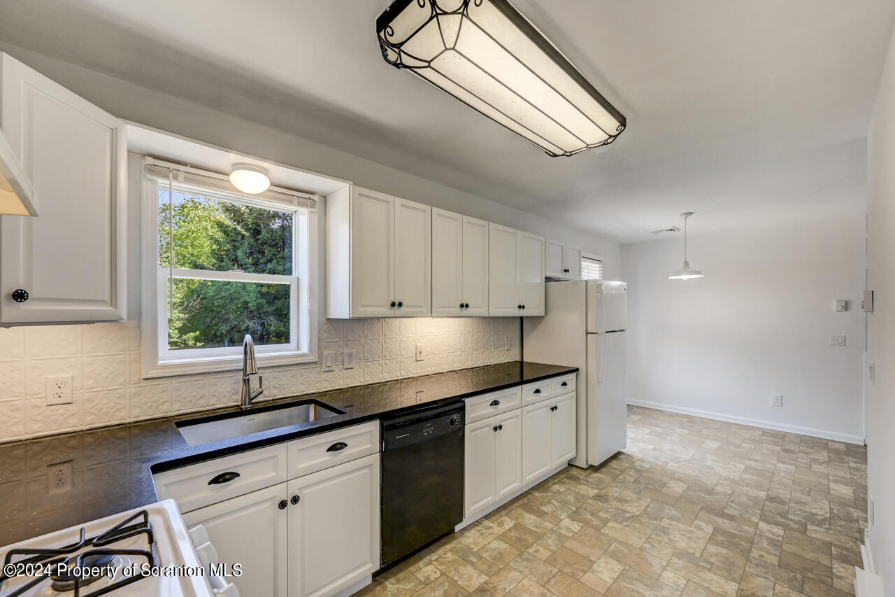 104 Bowens Road Moscow, PA 18444 - Photo 11 of 48 a kitchen that has a sink and a window
