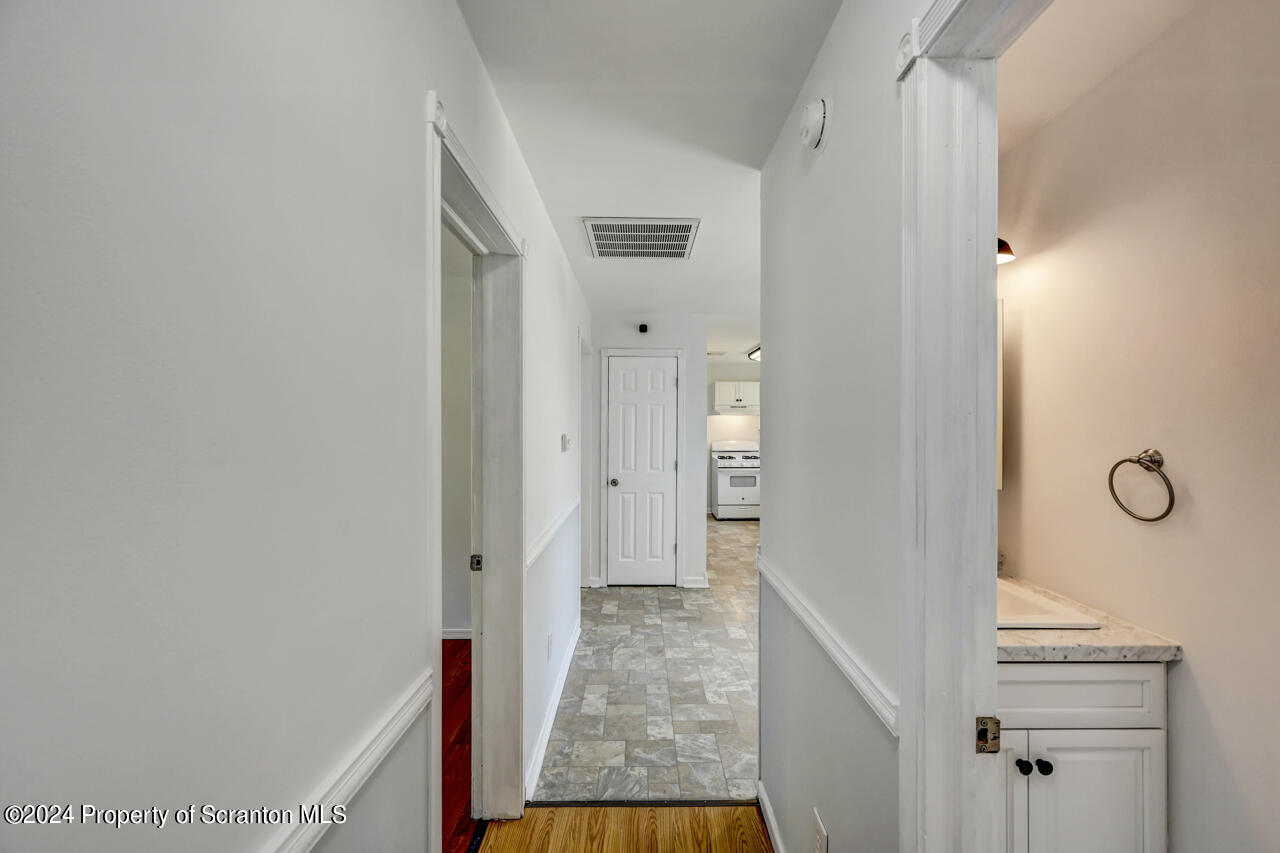 104 Bowens Road Moscow, PA 18444 - Photo 17 of 48 a view of a hallway with wooden floor and staircase