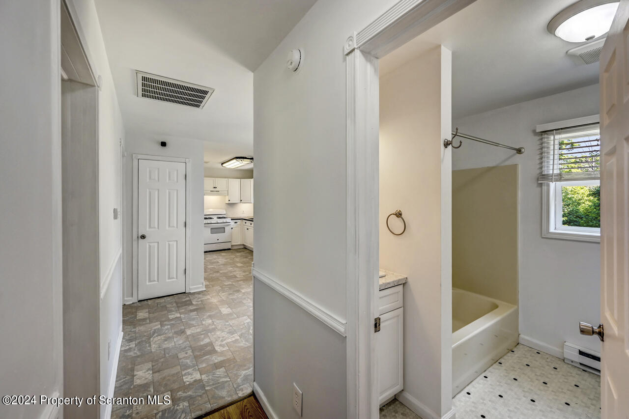 104 Bowens Road Moscow, PA 18444 - Photo 18 of 48 a bathroom with a tub shower and sink