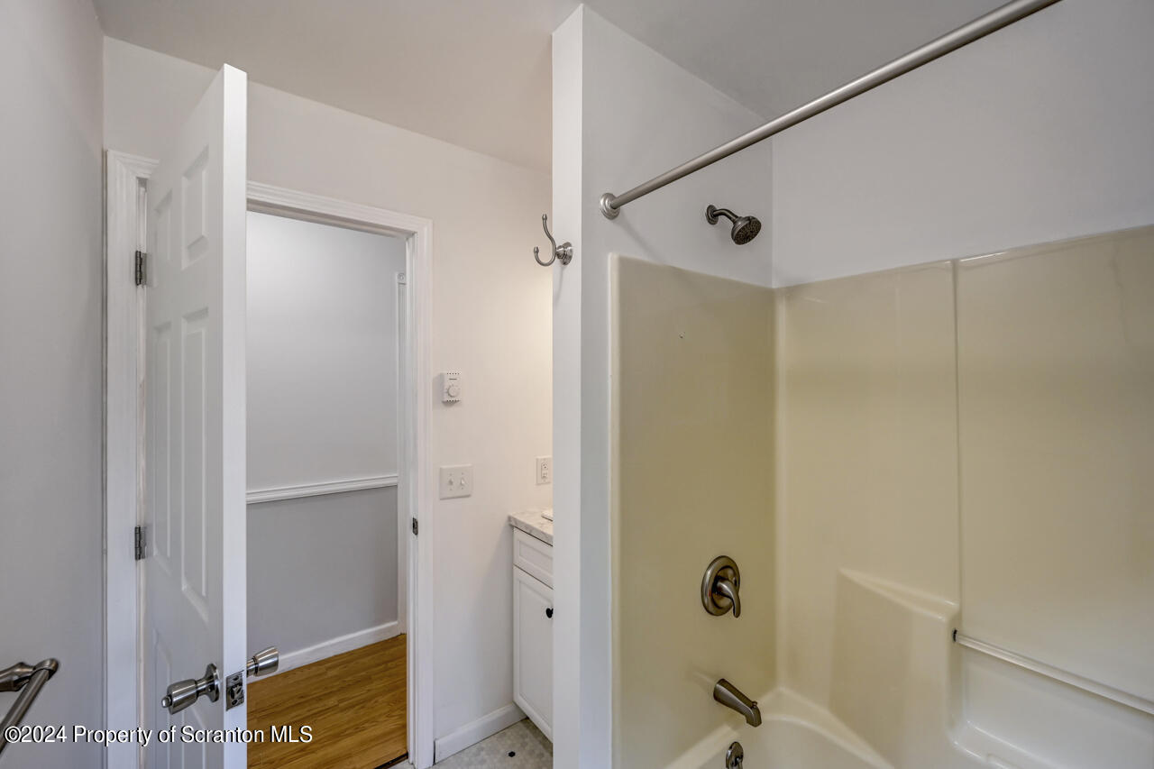 104 Bowens Road Moscow, PA 18444 - Photo 21 of 48 a bathroom with a tub and shower