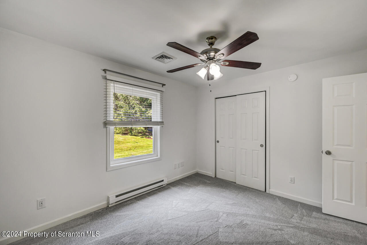 104 Bowens Road Moscow, PA 18444 - Photo 27 of 48 a view of an empty room with a window